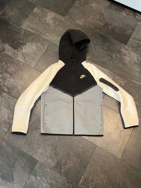 Nike tech Full‑Zip Hoodie in Black, Gray & White with Gold Swoosh